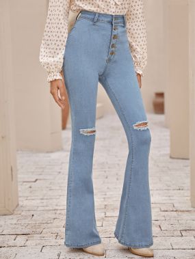 Рваные расклешенные джинсы с пуговицами