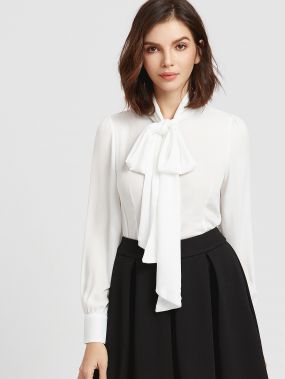 Белая асимметричная блуза с бантом
