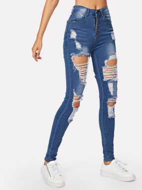 Рваные выбеленные обтягивающие джинсы с пуговицами