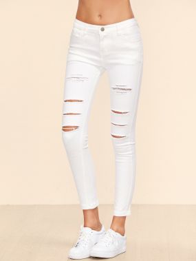 Белые модные джинсы с разрезами